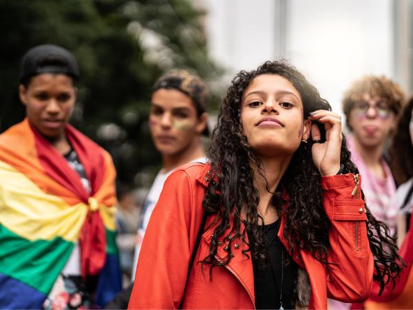 Young woman and rainbow flag 