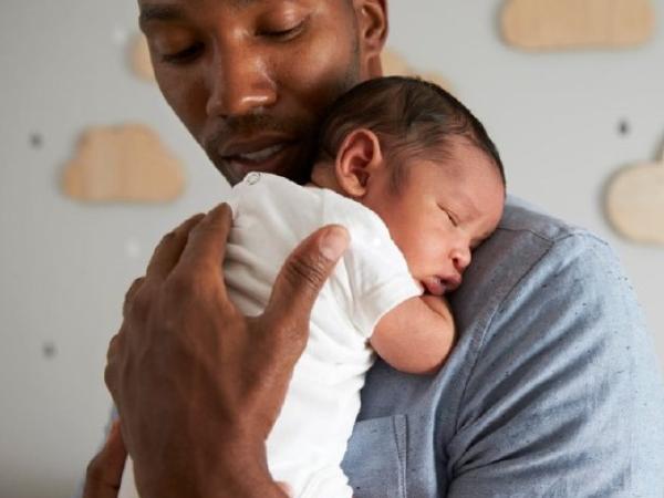 dad holding baby