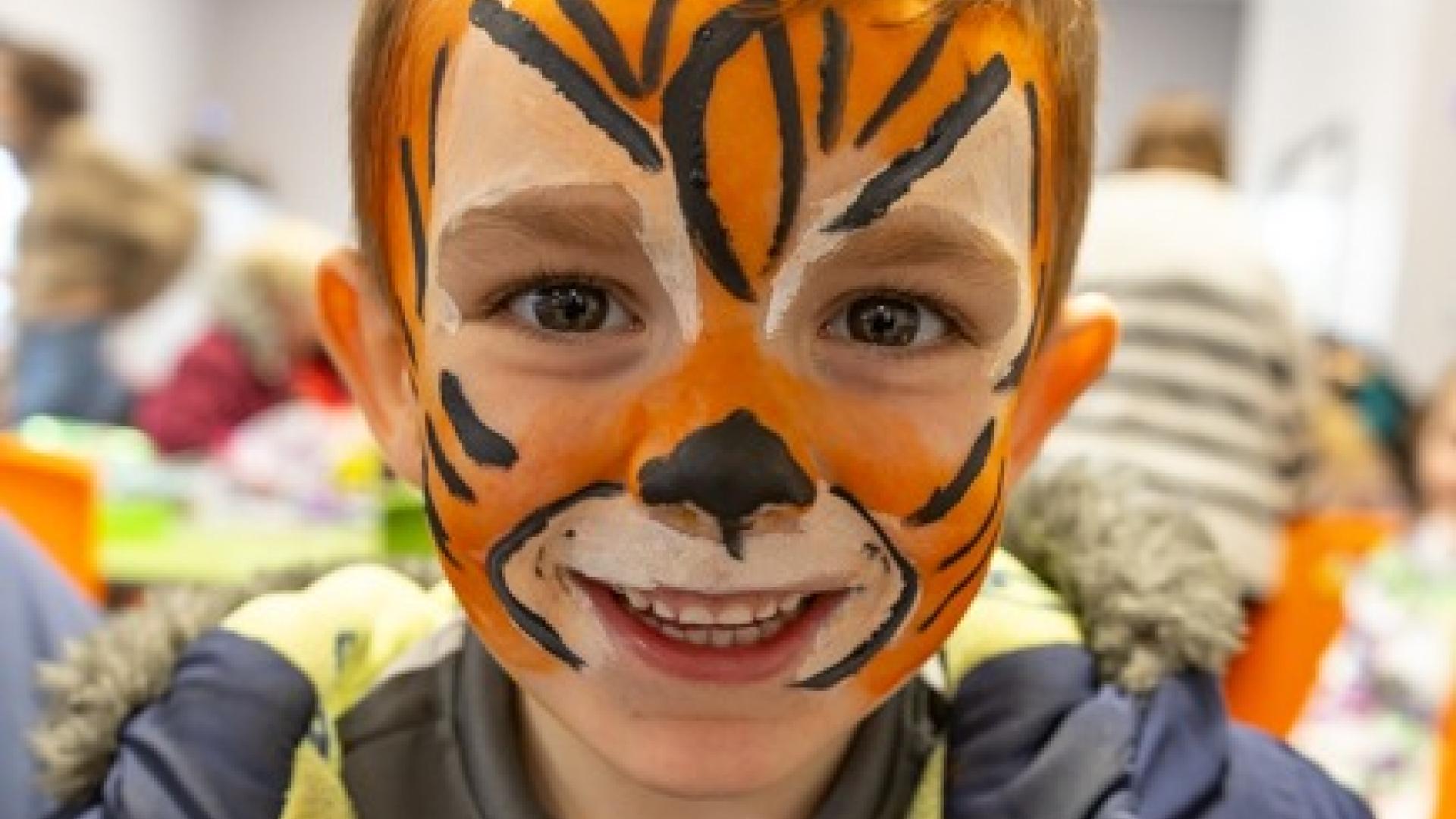 Boy with tiger face painting