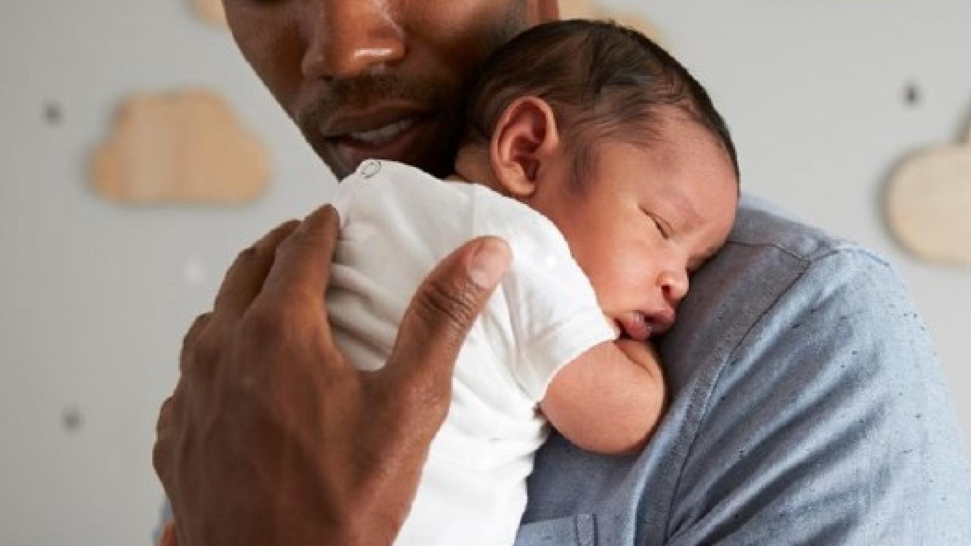 dad holding baby